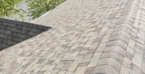 Gray asphalt shingle ridge near dormer