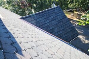 Roof valley with black flashing and brickwork
