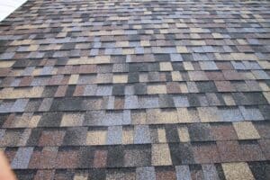 Close-up of a multicolored asphalt shingle roof.