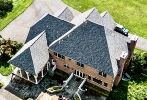 Aerial view of large brick mansion roof