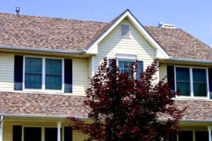 Tan house with brown architectural shingles