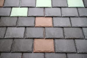 Close-up slate roof shingles with accent tiles